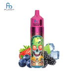 A colorful vape device with a skull graphic, surrounded by strawberries, blueberries, blackberries, and ice cubes.