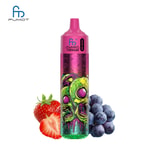 A colorful vape device with a skull design and vibrant graphics, accompanied by strawberries and blueberries.
