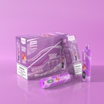 Une boîte à vape VOPK White Mamba violette comprenant 10 vapes jetables, étiquetées avec 15 000 bouffées et un arôme de narguilé chicha, affichées avec des étiquettes d'avertissement et une vape positionnée à l'extérieur de la boîte.
