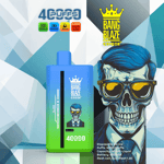 Bang Blaze Color disposable vape packaging with blue and green device, geometric background, crown logo, and illustrated character with blue hair and glasses; product specifications listed in the corner.
