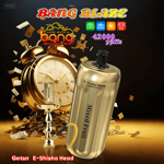 Promotional image for Bang Blaze vape, featuring a gold disposable e-shisha device labeled 'Mixed Fruit' and '42000 Puffs', an alarm clock, scattered money, and product feature icons against a dark background.