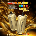 Promotional image featuring two gold Bang Blaze disposable e-shisha devices with Peach Ice flavor, highlighting 42,000 puffs capacity, 30ml liquid, 1000mAh battery, and mesh coil, set against a swirling gold and brown abstract background.
