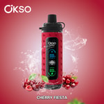 Dispositivo eletrônico vermelho OKSO Shishai com display digital, cercado por cerejas e salpicos de água em um fundo vermelho gradiente, rotulado Cherry Fiesta.