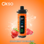 Dispositivo vape OKSO Shishai com design laranja com display digital, rodeado por salpicos de água, um morango e fatias de melancia, com o sabor 'Melancia Morango' rotulado abaixo.