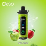 Maçãs verdes e vermelhas com respingos de água cercam um dispositivo vape OKSO Shishai rotulado como 'TWO APPLE' em um fundo verde.