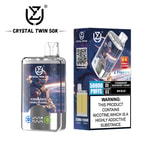 Crystal Twin 50K disposable vape packaging and device featuring a space-themed design, showing two flavors (Strawberry Raspberry Cherry and Mr Blue), double flavor icon, and a nicotine addiction warning label.