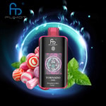 Fumot Tornado vape device with a digital display, surrounded by colorful candies and mint leaves against a glowing, cosmic background.