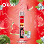 Cikso Crystal Bar Vape-Gerät mit Lush Ice-Geschmack, abgebildet mit Wassermelonenscheiben, Eiswürfeln und Minzblättern auf einem leuchtend roten, wirbelnden Hintergrund.