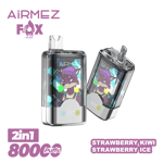 Two AIRMEZ FOX disposable vape devices with a purple fox mascot on geometric color panels, AIRMEZ FOX branding, and a '2in1 800 Puffs' label, indicating Strawberry Kiwi Strawberry Ice flavor.