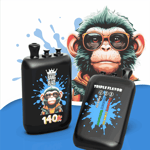 Colorful cartoon monkey wearing orange sunglasses with two black spray bottle-like containers labeled Bang Blaze 140K and a flavor splash chart on other bottle, set against a blue and white background.