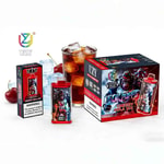 A colorful vape product display featuring UZY branded bottles and a large box labeled Cherry Cola Ice, with a glass of soda and cherries in the background.