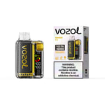 Vozol Mango Ice vape device with a carbon-fiber panel and gold accents next to its packaging box labeled Vista 20000, warning nicotine box on front.