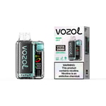 Vozol Miami Mint Vista 20000 vape device with carbon fiber finish and turquoise accents beside its white box packaging showing instructions and warning label.