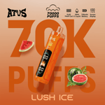 A cylindrical orange vape device angled diagonally over a peach-to-orange gradient background with large "70K PUFFS" text; watermelon slice on left, watermelon half with leaves on right, and the flavor name LUSH ICE at bottom.