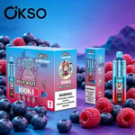 Bright blue and purple background with OKSO Tornado product boxes in foreground and scattered blueberries and raspberries around.