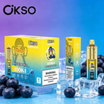 Bright yellow OKSO Tornado vaping boxes with blue and purple gradient background, blueberries and ice cubes in foreground.