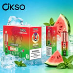 Bright red Ökso Tornado product boxes with mint leaves, watermelon slices, and ice cubes against a blue-green gradient backdrop.