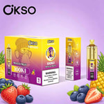 Colorful packaging of OKSO Tornado mixed fruit vape boxes with fresh fruit illustrations (strawberries, blueberries, pineapple) on a purple background.