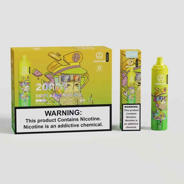 A colorful vape product packaging featuring a cartoonish monkey wearing glasses and a hat. The box displays "20 puffs" and the flavor "triple mango" with a warning label about nicotine. Beside the box, there is a green vape device with similar design elements and a matching warning label.