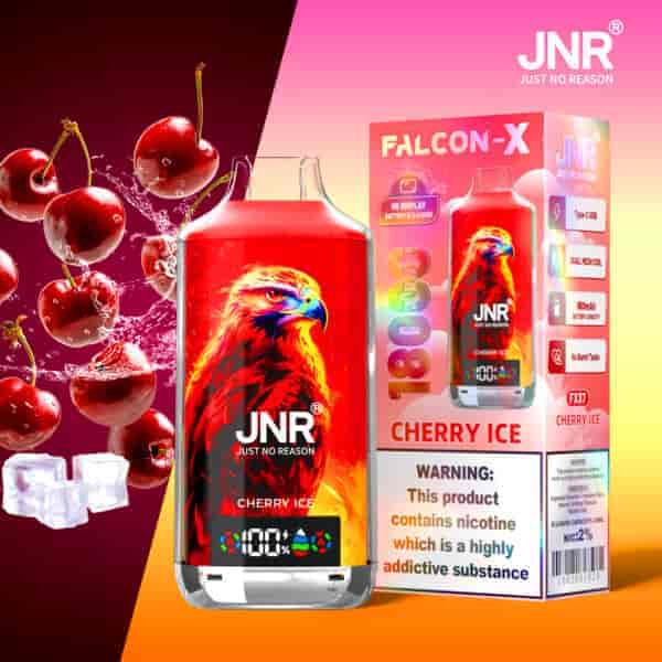 Un produit de vape rouge vif étiqueté " JNR Cherry Ice " avec une illustration d'aigle, à côté de sa boîte d'emballage affichant les détails du produit, des glaçons et des cerises en arrière-plan.