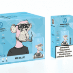 A blue packaging box for a disposable vape product named "Mr. Blue," featuring a cartoon monkey wearing glasses and smoking. The box displays information about the product, including features like "15000 PUFFS," "oil indicator," and "power indicator," along with a warning about nicotine. A clear vape device is shown next to the box, also labeled "Mr. Blue" with a digital readout.