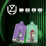 Two colorful vape devices, one purple labeled "Grape Ice" and one green labeled "Strawberry Kiwi," are displayed against a green striped background. Each device features a cartoon monkey illustration and a digital display showing battery status.