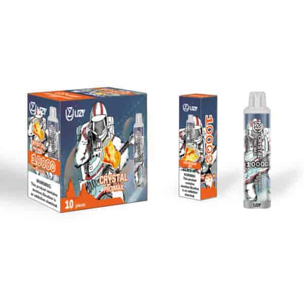 A vaping product packaging featuring an astronaut graphic, labeled "CRYSTAL PRO MAX" with "10,000" prominently displayed. The box is colorful with orange, blue, and white, and includes a warning about nicotine. A vape bottle is shown next to the box.