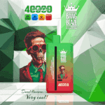 Vape product packaging with a red and green gradient design, displaying a stylized illustration of a person wearing a suit and bow tie, key specifications like 650mAh battery and 40ml capacity, and the brand name 'Bang Blaze Color', against an abstract green geometric background.
