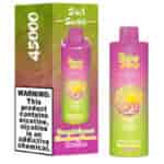 Embalagem e dispositivo de vape Bang King Triple 3 em 1 Switch nas cores gradiente rosa e verde, apresentando os sabores Abacaxi, Coco, Morango, Banana e Blue Razz, com um rótulo de advertência informando que o produto contém nicotina.
