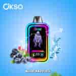 Colorful OKSO vape device with neon-lit design, surrounded by berries, mint leaves, ice cubes, and water splashes, labeled 'Blue Razz Ice' on a blue gradient background.