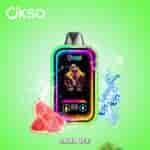 Colorful OKSO vape device with a streetwear-clad figure on its display, surrounded by watermelon slices, ice cubes, water splashes, and labeled "Lush Ice" on a green background.
