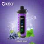 Purple OKSO Shishai vape device with a digital display, surrounded by grapes, mint leaves, ice splashes, and labeled 'GRAPE MINT' on a purple background.