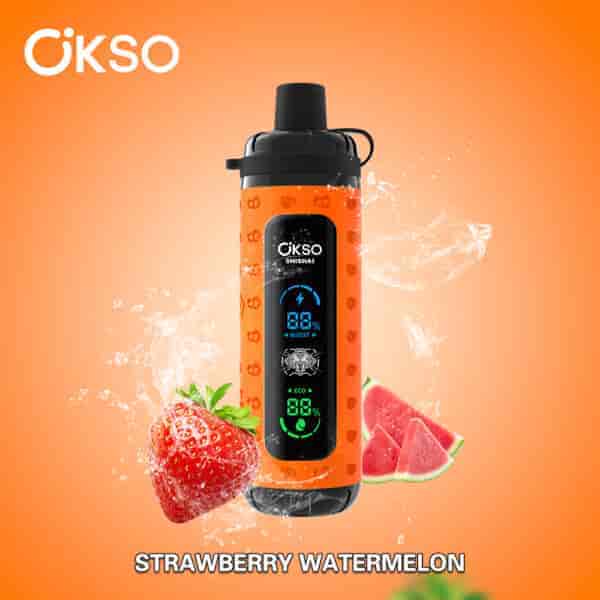 OKSO Shishai vape device with an orange design featuring digital display, surrounded by splashes of water, a strawberry, and watermelon slices, with the flavor 'Strawberry Watermelon' labeled below.