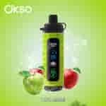 Green and red apples with water splashes surround an OKSO Shishai vape device labeled 'TWO APPLE' on a green background.