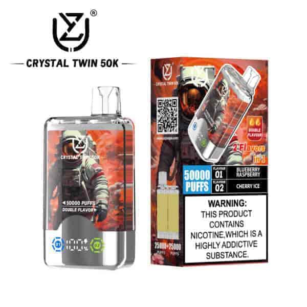 Crystal Twin 50K disposable vape device and packaging featuring an astronaut graphic, offering 50,000 puffs and two flavors (blueberry raspberry and cherry ice), with a nicotine addiction warning label.
