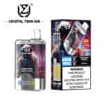 Crystal Twin 50K vape product showing a transparent device with astronaut artwork, 50,000 puffs label, flavor indicators, and packaging that displays flavors (Strawberry Banana, Love 66), double flavor feature, and a nicotine addiction warning.