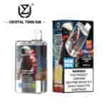 Crystal Twin 50K vape device and packaging featuring an astronaut illustration, flavor indicators for strawberry kiwi and grape ice, "50000 PUFFS" prominently displayed, and a nicotine addiction warning label.