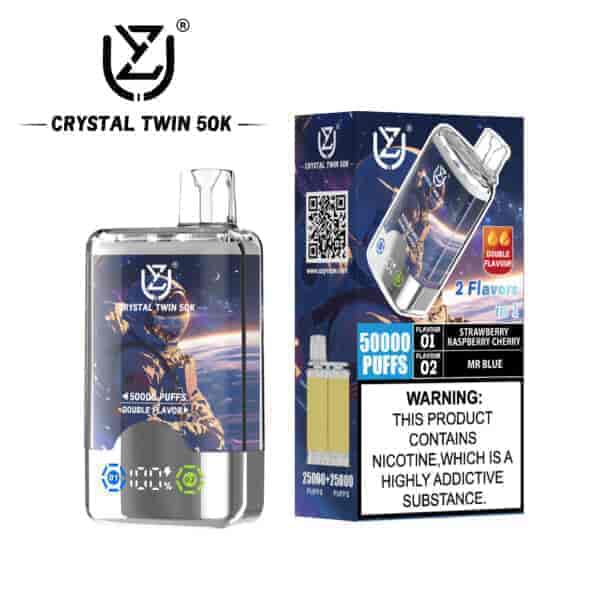 Crystal Twin 50K disposable vape packaging and device featuring a space-themed design, showing two flavors (Strawberry Raspberry Cherry and Mr Blue), double flavor icon, and a nicotine addiction warning label.