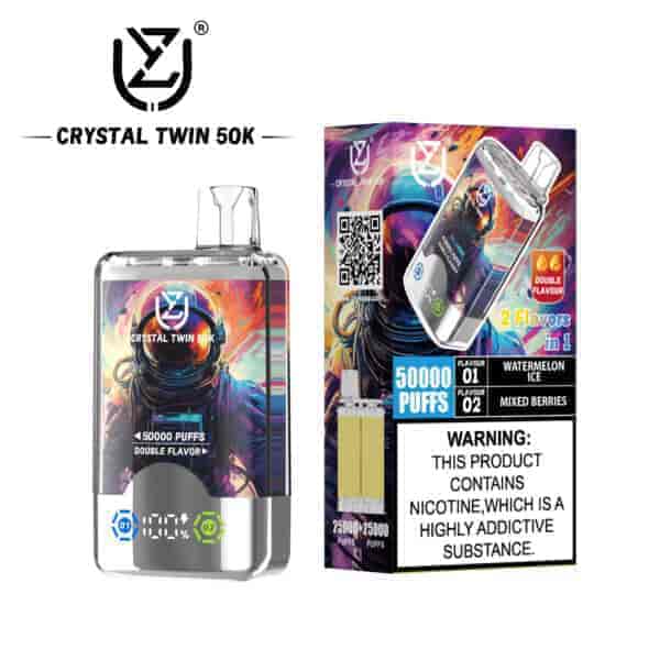 Crystal Twin 50K disposable vape device and packaging featuring a colorful astronaut illustration, indicating 50,000 puffs, double flavors (watermelon ice and mixed berries), and a nicotine addiction warning label.