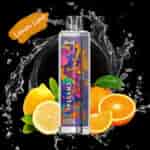 Appareil à vapoter jetable coloré avec un motif de singe vibrant, illustré avec des citrons, des oranges et un effet éclaboussant en arrière-plan, étiqueté ' Lemon Lime '.'