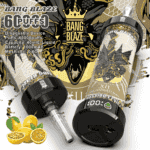 Two Bang Blaze disposable vape devices with intricate gold and black artwork, showing product details and a passion fruit flavor indication with fresh passion fruit in the foreground.