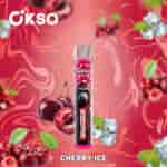 Cikso Cherry Ice vape デバイスは、前面にゴリラのイメージがあり、チェリー、氷、渦巻く赤い背景に囲まれています。.