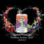 UWIN Crystal Twins vape device with a cartoon monkey design, surrounded by splashes of water, strawberries, raspberries, cherries, blueberries, and blackberries on a black background, highlighting flavors like strawberry, raspberry, cherry, and Mr Blue.
