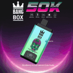 Colorful Bang Box vape device with a cartoon zombie face design, surrounded by branding and feature highlights including mesh coil, 850mAh battery, Type-C charging, 50,000 puffs, 22ml capacity, and labeled flavor 'Blueberry Ice & Lemon Cola Soda'.