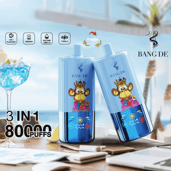 Two blue BANG DE vape devices with a cartoon monkey wearing a crown, posed on a table with a cocktail, lemon slices, and blurred beachside background, highlighting '3 IN 1', '80,000 PUFFS', and product features.