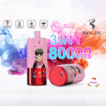 Colorful vape device labeled 'BANG DE' with a cartoon character design, boasting '3 in 1 flavour,' '8000 puffs,' and '650mAh' battery, surrounded by vibrant smoke in blue, pink, and orange hues.