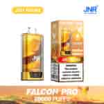 Appareil de vape jetable JNR Falcon Pro et emballage présentant une saveur de faucon et de ' pêches juteuses ', avec un étiquetage en gras pour 28 000 bouffées et un avertissement de dépendance à la nicotine.