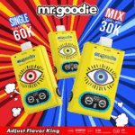 Advertisement for 'mr.goodie' vape devices showing three yellow cartridges with illustrated eyes, set against a vibrant red and blue comic-style background highlighting 'Single Flavor Mode 60K' and 'Mix Flavors Mode 30K'.