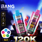 Deux appareils de vapotage Bang Legend 5in1 colorés, un bleu avec une caricature de singe fumant portant un chapeau et un rose avec une caricature de singe portant des écouteurs et des lunettes de soleil, affichant tous deux 120K et 0% sur des écrans numériques, placés sur un fond rocheux enfumé avec des caractéristiques du produit telles qu'une bobine en maille, une capacité de 50 ml et des icônes de charge de type C sur le côté gauche.