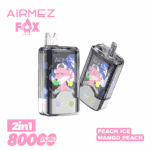 Deux appareils de vape transparents avec des illustrations colorées sur leurs écrans, inclinés côte à côte sur un fond blanc, avec la marque rose AiRMEZ et un logo renard, avec ' 2in1 800 Puffs ' en bas à gauche et une étiquette de saveur ' Peach Ice Mango Peach ' en bas à droite.